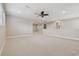 Spacious bonus room with ceiling fan and carpet at 10825 Charmwood Dr, Riverview, FL 33569