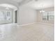 Dining area with tile floors, neutral walls, and chandelier lighting at 10825 Charmwood Dr, Riverview, FL 33569