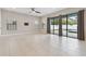 Bright Gathering room featuring tile floors and pool access at 10825 Charmwood Dr, Riverview, FL 33569