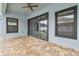 Covered lanai with sliding glass doors overlooking the pool at 10825 Charmwood Dr, Riverview, FL 33569