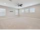 Large loft bedroom with ceiling fan and multiple windows at 10825 Charmwood Dr, Riverview, FL 33569