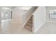 Modern carpeted staircase with tile flooring at 10825 Charmwood Dr, Riverview, FL 33569