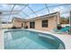 Relaxing screened-in pool with plenty of room for lounging at 11424 Zenith Cir, Tampa, FL 33635