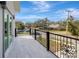 Outdoor balcony overlooking a residential neighborhood, featuring a metal railing at 11926 Riverhills Dr, Tampa, FL 33617