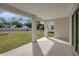 Covered patio with concrete flooring and access to backyard at 11926 Riverhills Dr, Tampa, FL 33617