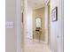 Elegant hallway with tiled floors and a decorative console table at 1200 Gulf Blvd # 102, Clearwater Beach, FL 33767