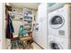 Bright laundry room with washer, dryer and storage at 1200 Gulf Blvd # 102, Clearwater Beach, FL 33767