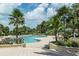 Resort-style pool with lounge chairs and palm trees at 1200 Gulf Blvd # 102, Clearwater Beach, FL 33767