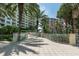 Paved walkway with tropical landscaping and railings at 1200 Gulf Blvd # 102, Clearwater Beach, FL 33767