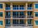 Building exterior with multiple balconies and water views at 130 Riviera Dunes Way # 605, Palmetto, FL 34221