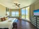 Spacious main bedroom with water views and king-size bed at 130 Riviera Dunes Way # 605, Palmetto, FL 34221