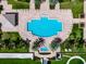 Resort-style pool with plenty of lounge chairs at 130 Riviera Dunes Way # 605, Palmetto, FL 34221