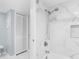 Bathroom with marble shower and built-in shelving at 13561 105Th Ave, Largo, FL 33774