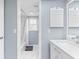 Clean bathroom with white vanity and marble shower at 13561 105Th Ave, Largo, FL 33774