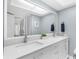 Modern bathroom with double vanity and white cabinets at 13561 105Th Ave, Largo, FL 33774