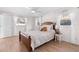 Bedroom with wood bed frame and light colored walls at 13561 105Th Ave, Largo, FL 33774