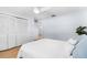 Bedroom with white bedding and built-in closet at 13561 105Th Ave, Largo, FL 33774