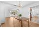 Bright dining room with wood table and view into kitchen at 13561 105Th Ave, Largo, FL 33774