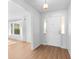 Bright entryway with white door and hardwood floors at 13561 105Th Ave, Largo, FL 33774