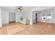 Open living and dining area with light wood floors at 13561 105Th Ave, Largo, FL 33774