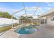 Inviting screened pool area with brick pavers at 13561 105Th Ave, Largo, FL 33774