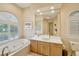 Bathroom with soaking tub, double vanity and a large shower at 15209 Leith Walk Ln, Tampa, FL 33618