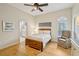 Bright bedroom with hardwood floors and ensuite bathroom at 15209 Leith Walk Ln, Tampa, FL 33618