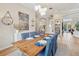 Bright dining room with a farmhouse table and view of the kitchen at 15209 Leith Walk Ln, Tampa, FL 33618