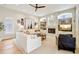 Living room with fireplace, built-in shelving and hardwood floors at 15209 Leith Walk Ln, Tampa, FL 33618