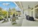 Large screened patio with brick pavers and seating area at 15209 Leith Walk Ln, Tampa, FL 33618