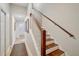 Elegant staircase with wooden steps and white railing at 15209 Leith Walk Ln, Tampa, FL 33618