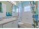 Stylish bathroom with white cabinets, decorative shower curtain, and bathtub at 16213 Diamond Bay Dr, Wimauma, FL 33598