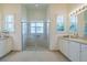 Large Primary bathroom with a walk-in shower, double vanity and elegant fixtures at 16213 Diamond Bay Dr, Wimauma, FL 33598