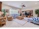 Spacious living room with ample seating and built-in shelving at 16213 Diamond Bay Dr, Wimauma, FL 33598