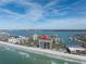 Aerial view of beachfront condo building with ocean and marina views at 1660 Gulf Blvd # 304, Clearwater Beach, FL 33767