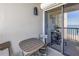 Small balcony with table and chairs at 1660 Gulf Blvd # 304, Clearwater Beach, FL 33767