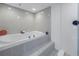 Relaxing bathroom with soaking tub and tiled walls at 1660 Gulf Blvd # 304, Clearwater Beach, FL 33767