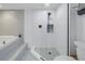 Clean bathroom with walk-in shower and tiled walls at 1660 Gulf Blvd # 304, Clearwater Beach, FL 33767