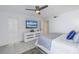 Spacious bedroom with large TV and dresser at 1660 Gulf Blvd # 304, Clearwater Beach, FL 33767