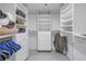 Large walk-in closet with ample shelving and drawers at 1660 Gulf Blvd # 304, Clearwater Beach, FL 33767