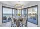 Bright dining room with ocean view and modern table at 1660 Gulf Blvd # 304, Clearwater Beach, FL 33767