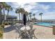 Community pool with patio seating at 1660 Gulf Blvd # 304, Clearwater Beach, FL 33767