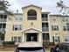 Three-story apartment building with light yellow siding and balconies at 18477 Bridle Club Dr # 18477, Tampa, FL 33647