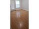 Spacious living room featuring light brown laminate flooring at 18477 Bridle Club Dr # 18477, Tampa, FL 33647