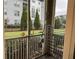 Screened-in porch with storage rack overlooking grassy area at 18477 Bridle Club Dr # 18477, Tampa, FL 33647