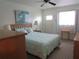 Spacious bedroom with a king-size bed and private access at 1900 59Th N Ave # 212, St Petersburg, FL 33714