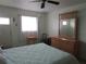 Bedroom with king bed, dresser, and ceiling fan at 1900 59Th N Ave # 212, St Petersburg, FL 33714