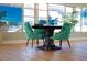 Common area with stylish teal chairs and a round table at 1900 59Th N Ave # 212, St Petersburg, FL 33714