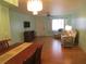 Bright dining area with hardwood floors and chandelier at 1900 59Th N Ave # 212, St Petersburg, FL 33714