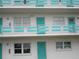 Three-story building with teal accents and balconies at 1900 59Th N Ave # 212, St Petersburg, FL 33714